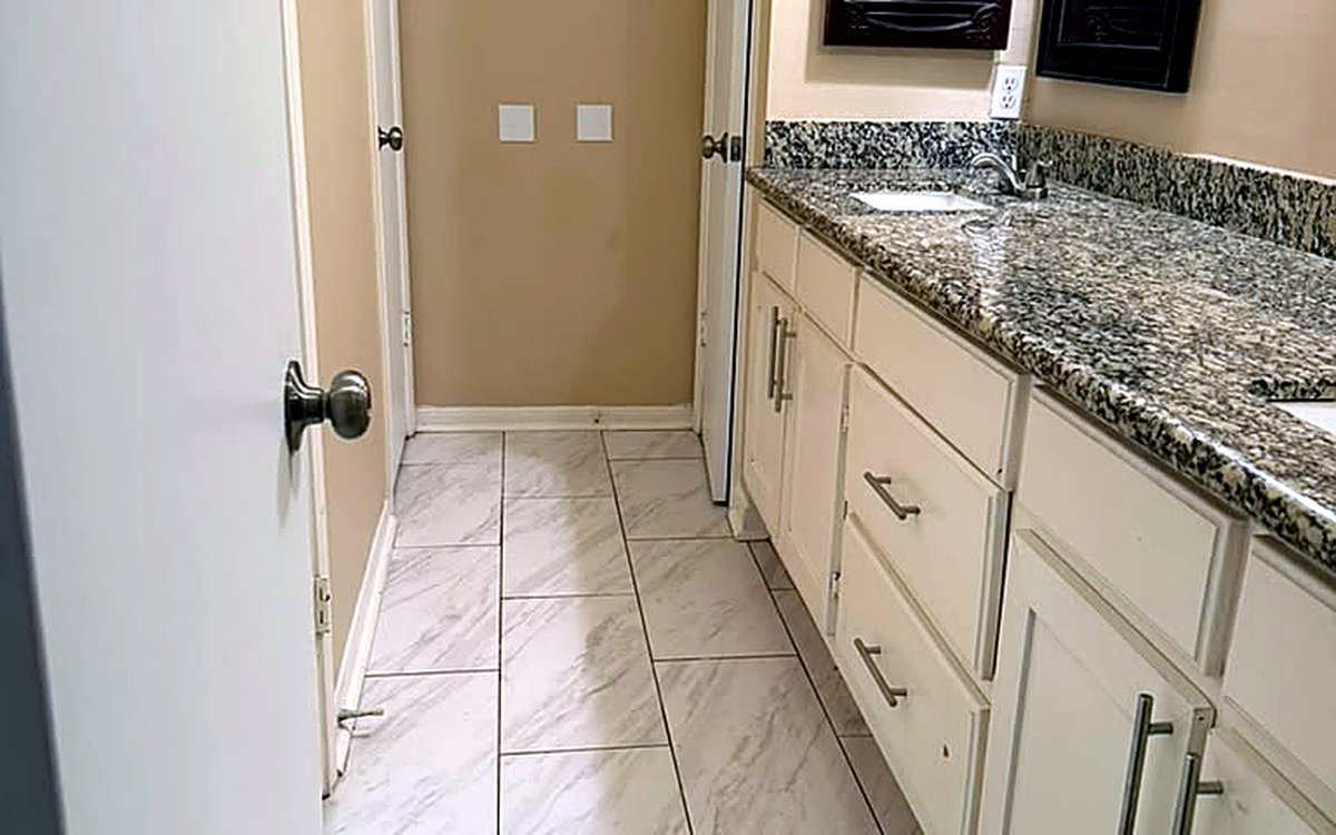 Freshly cleaned bathroom vanity and hallway