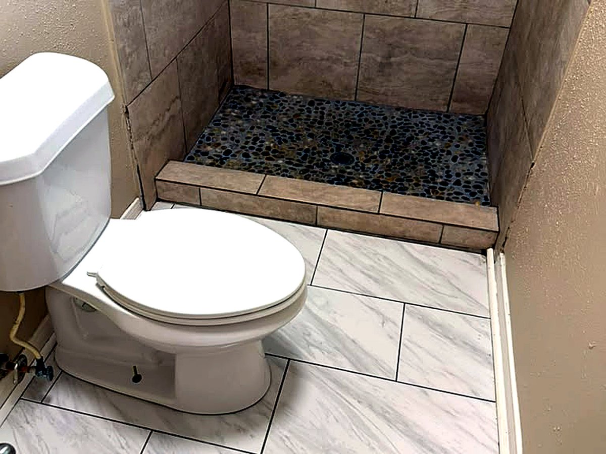 Spotless tiled shower and floor after cleaning